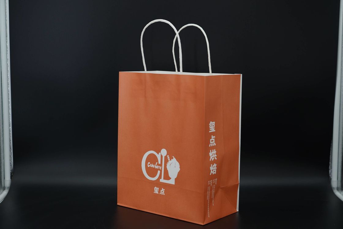 Custom Orange Eco Paper Bags With Handles Twisted Solid Plate Printing
